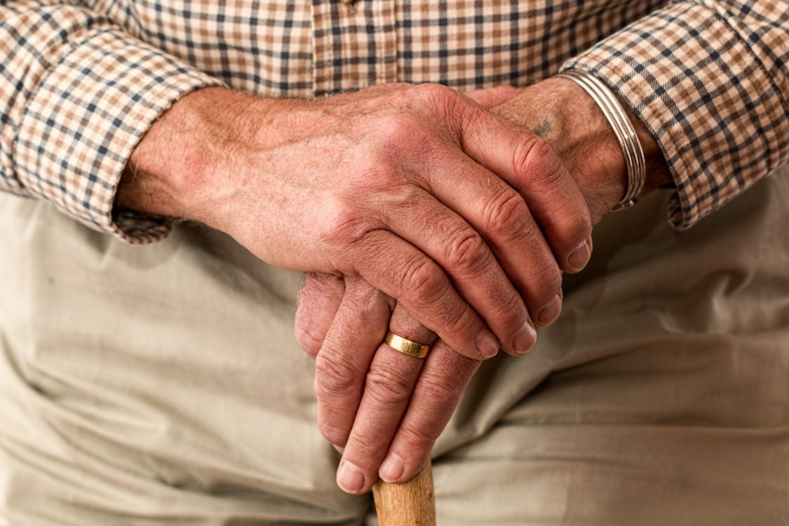 Elderly Gentleman Hands Holding Walking Stick - Magnolia Care Consultancy Blog - End of Life Care in Hampshire 