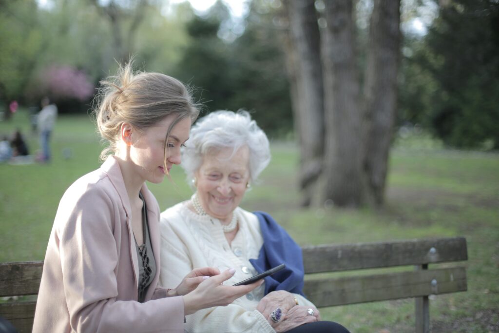 Young woman out with older woman on a bench