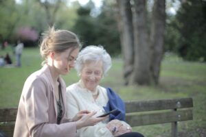 Young woman out with older woman on a bench