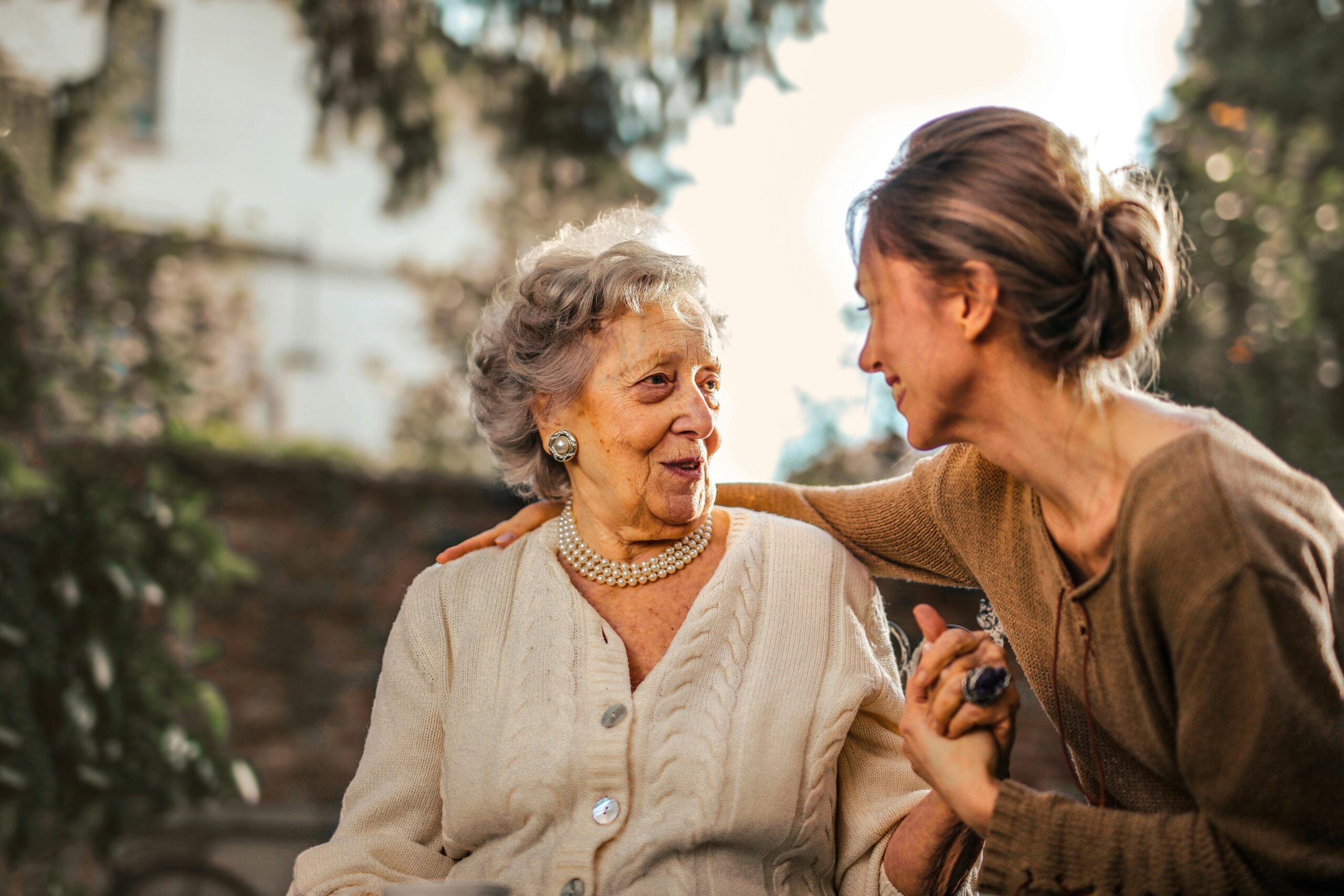 Young and old woman having a funny chat